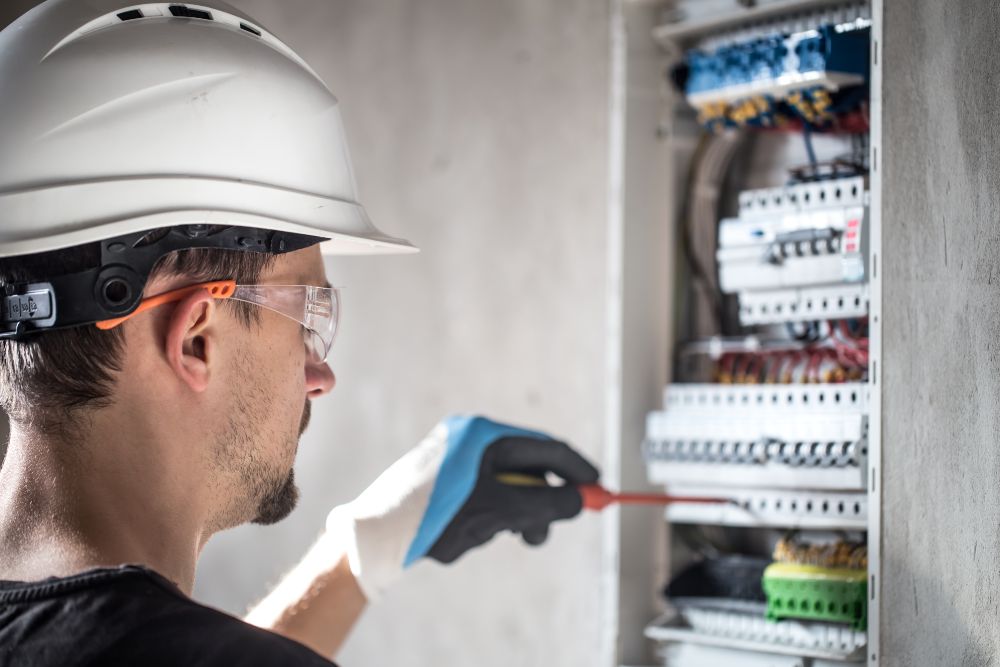 Electrician from Dave Fenech Electrical Services inspecting a home circuit board to ensure electrical safety and proper appliance maintenance. Electrician from Dave Fenech Electrical Services inspecting a home circuit board to ensure electrical safety and proper appliance maintenance.