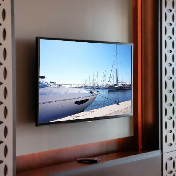 Dave Fenech Electrical Services electrician in Sydney completing professional TV wall mounting and installation with concealed wiring.