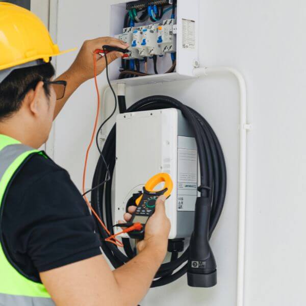 Electrician in Minto from Dave Fenech Electrical Services checking switchboard connections and voltage levels for safety. Electrician in Minto from Dave Fenech Electrical Services checking switchboard connections and voltage levels for safety.