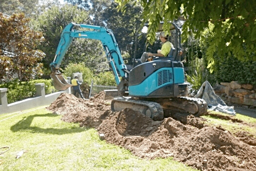 Excavator digging trench for underground electrical installation in Sydney by Dave Fenech Electrical Services Excavator digging trench for underground electrical installation in Sydney by Dave Fenech Electrical Services