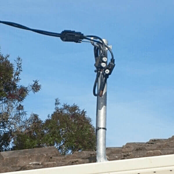 Point of attachment bracket and service cable installed by Dave Fenech Electrical Services Sydney for safe overhead power connection